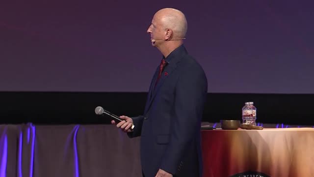 Ken Hartley speaking at the IMC in August 2017.
